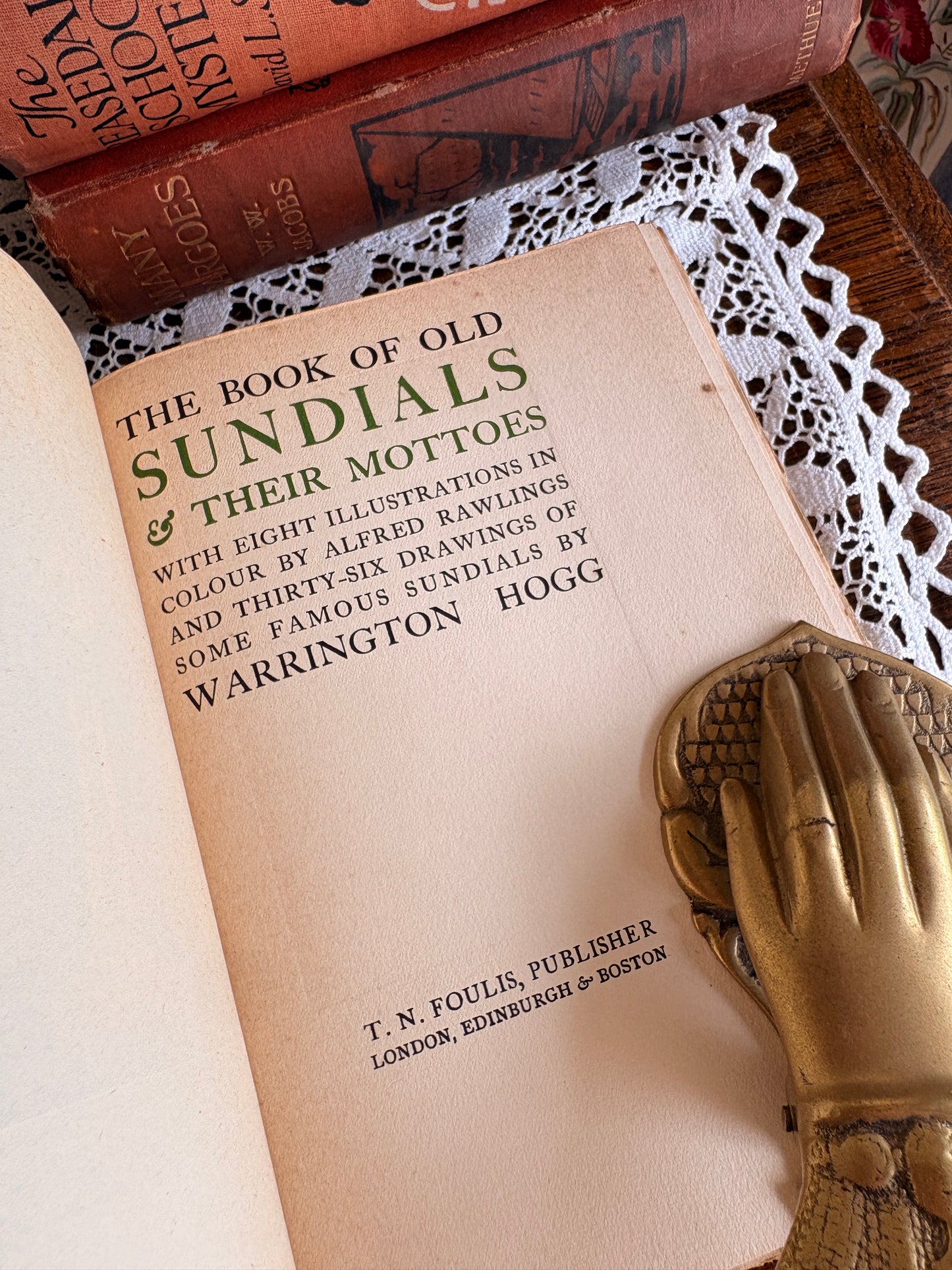 1914 The Book of Old Sundials & their Mottoes: With Eight Illustrations in Colour by Alfred Rawlings and Thirty-Six Drawings of Some Famous Sundials by Warrington Hogg. Cover designed by Jessie M. King.